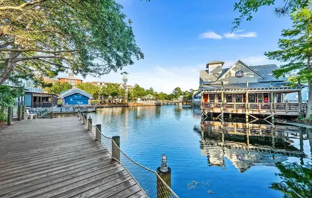 Baytowne Wharf boardwalk and restaurants on the lagoon, a short walk away