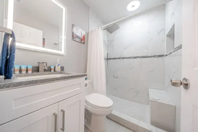 Bathroom with marble walk-in shower